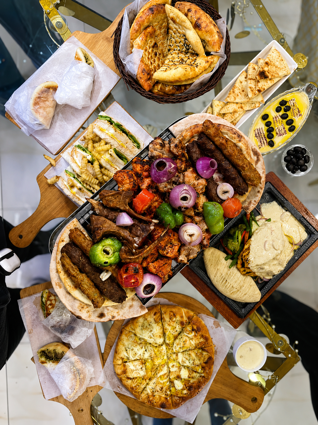 King's signature grill platter with kebabs, lamb chops, tikka, naan and pizza